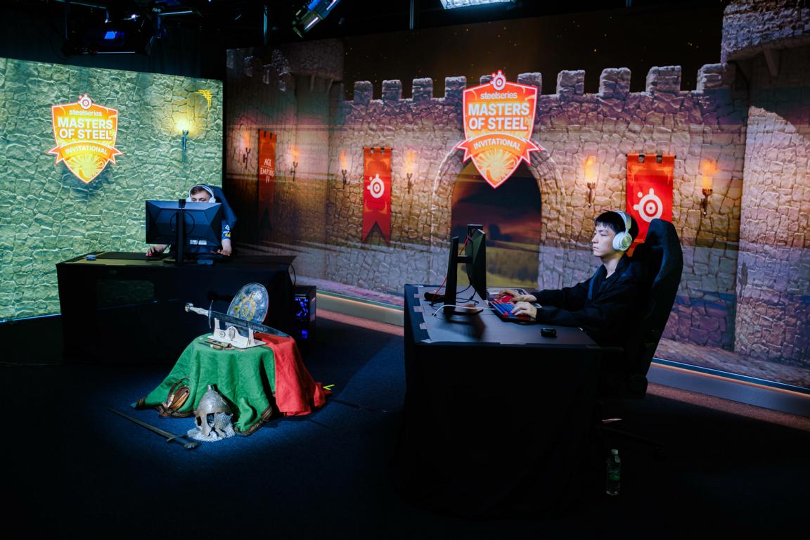 Players competing on a live tournament stage